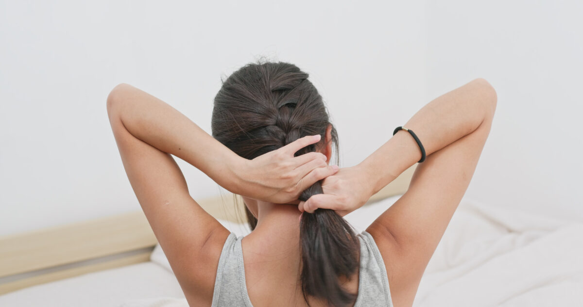 Woman,tied,her,in,braid,at,home